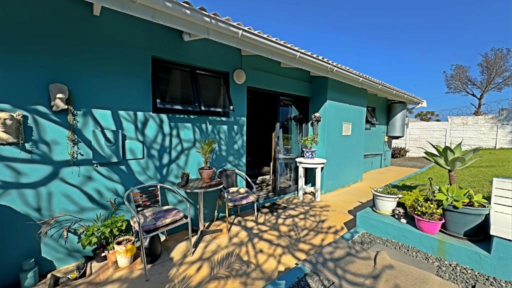 Turquoise garden accommodation with a private outdoor seating area